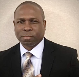Corey A. Cooper, Founder and CEO of Collar-Ways, in a dark suit and tie